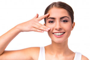 woman with braces teeth isolated