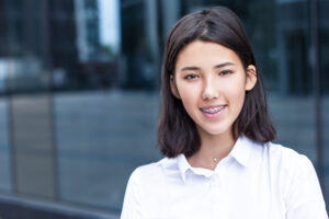 young-asian-woman-smiling-looking